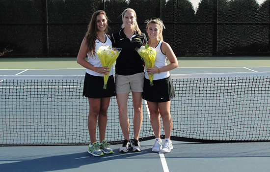 Seniors Olivia Hegner (L) and Deborah Massaro (R) were honored prior to the start of their final home match by head coach Erin Phillips